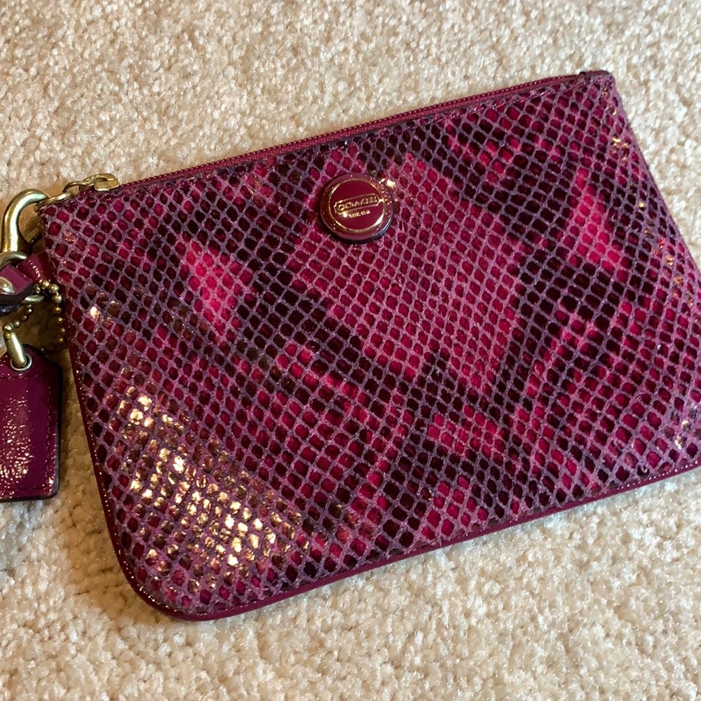 Pinkish/red snake print Coach wristlet